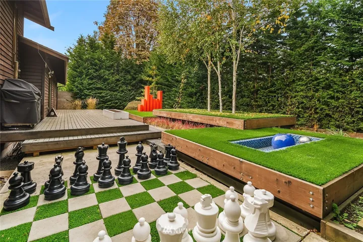 Your own park, just outside your back door.  No mow astro turf!  Beautiful plantings of trees for privacy and enjoyment.