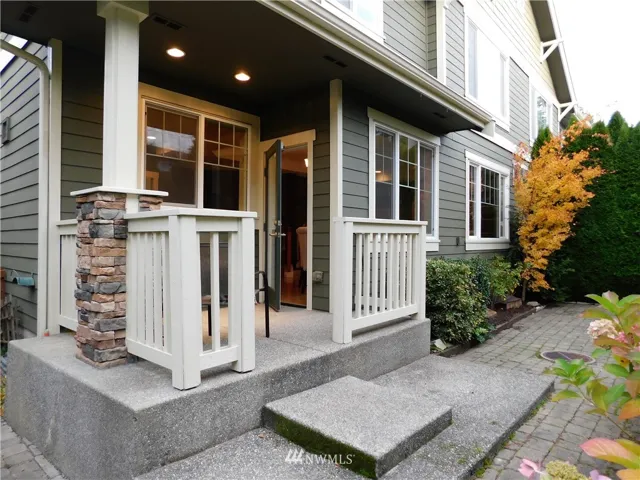 Great place to call home! The Exterior view of the rear covered patio - plenty of room for pots of veggies or flowers.....just enough, not too much.