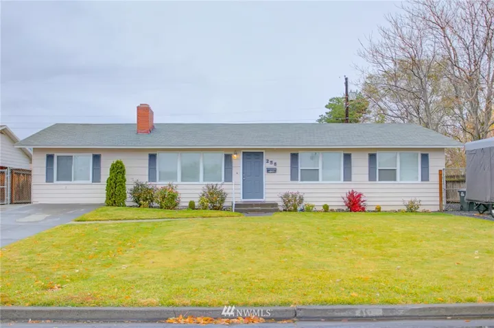 Vinyl windows and accent shutters are displayed on this remodeled home, with a "fire bush" in front and a full lawn in front and back. All doors, window trim, baseboard trim, light fixtures and hardware are all new in this beautiful home.