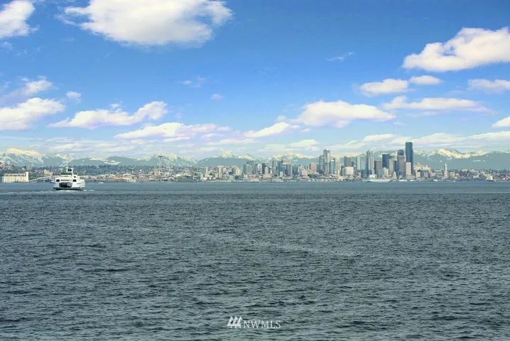 Welcome to 4106 Rockaway Beach Road. A gracious no-bank waterfront home with a fantastic beach and glorious views!