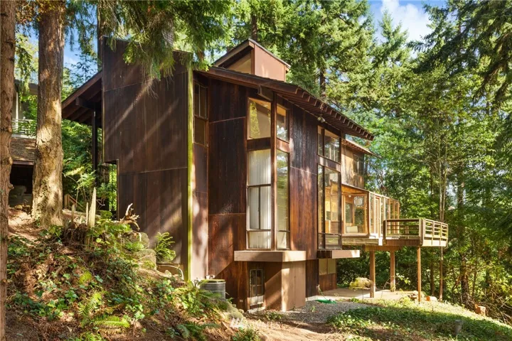 1968 Mid Century Inspired home custom architectural home located in Medina, WA.  Wondeful windows take full advantage of the natural landscape and lake views.