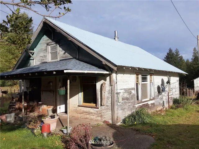 Main Home, newer porch roof and metal roof