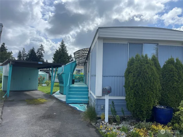 Spacious Single Wide Mobile Home with covered parking, deck, storage unit and it's situated on one of the larger corner lots in the Bow Lake Community.  There's additional storage under the deck!  You're going to love living here.