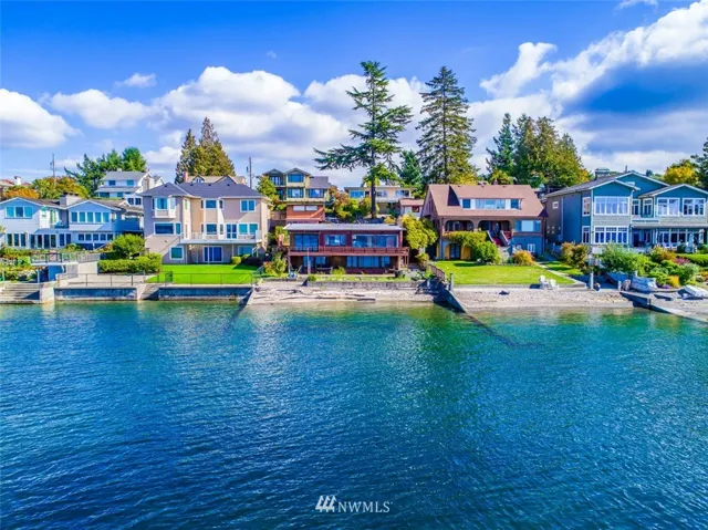 Log home is in center of photo at high tide.  Property features approximately 60 feet of Puget Sound waterfront.