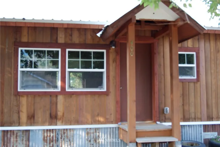 400 Twisp Avenue W. offers 2 bed and 1 full bath, New Kitchen cherry wood cabinets, all appliances included. Wood floors. Large lot has room for a garden, greenhouse and Garage! Must see this home in Twisp! Covered entry to the front door at 400 Twisp Ave W. has tons of charm! 736 SF remodel is so well done!
