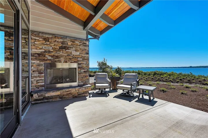 South facing outdoor patio provides ample sunshine throughout the day. Relax next to the cozy outdoor fireplace as you enjoy unobstructed views of Drayton Harbor.