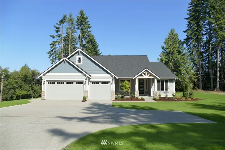 Completed new construction by Rob Rice Homes on large .88 acre lot with sound & rainier views. The Valhalla offers 3 bedrooms +den, 3.5 bathrooms, Living Room, Dining Room, Upper Level Bonus Room AND Theater Room with Wet Bar!
