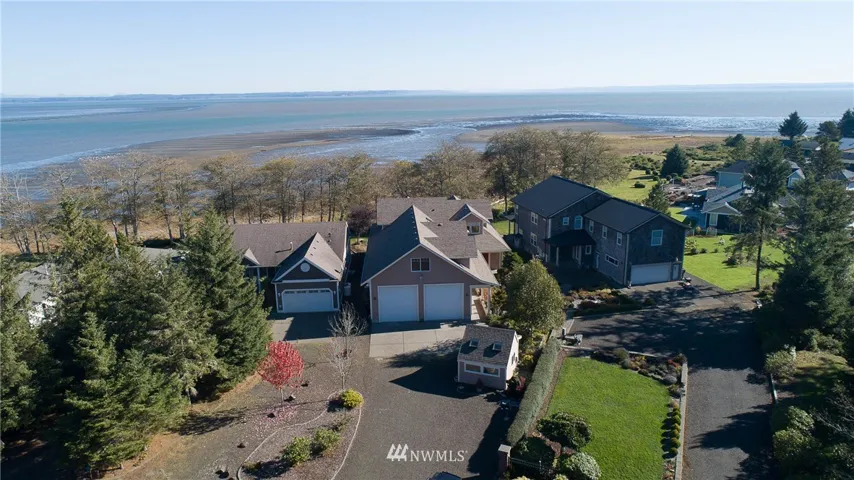Overhead shot of property with the bay beyond.