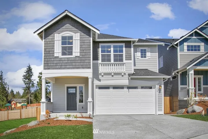 Photos of same home plan on different homesite in Wood Bridge. Finish and features may differ.