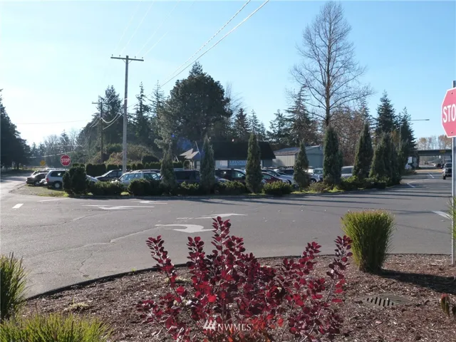 The property as seen looking from North to South. There is a used car lot paying $900 per month rent and a 2 bedroom home behind also paying $900 per month rent.