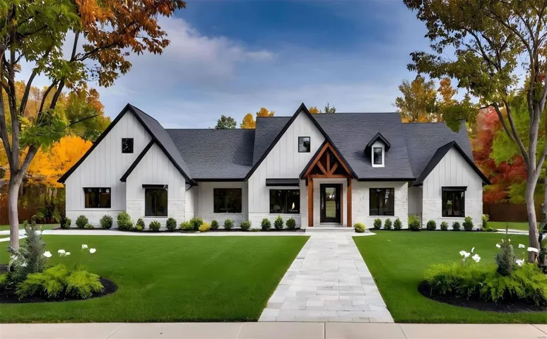 Modern farmhouse style home with a front lawn