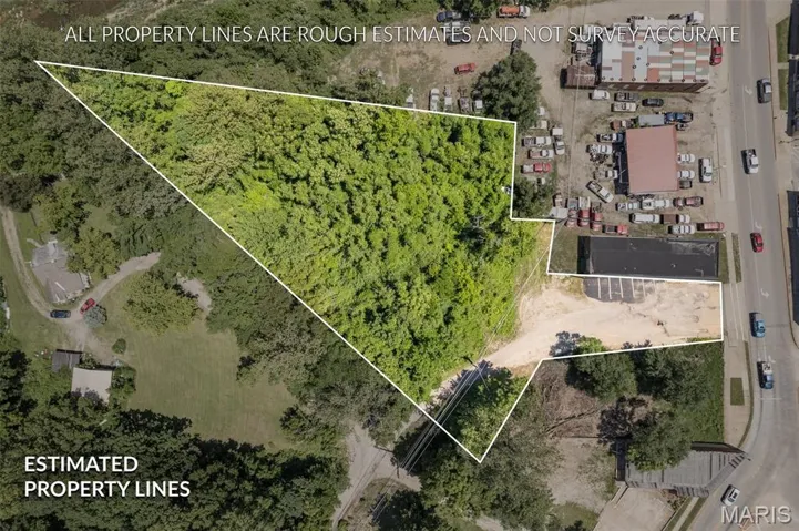 Aerial view of property and surrounding area with property boundaries highlighted