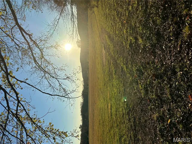 View of green lawn featuring a rural view