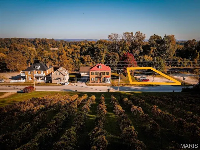 View of playground with a wooded view