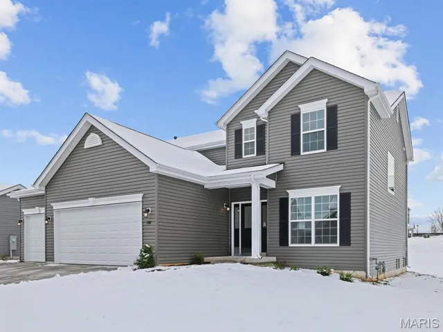 Traditional-style house with an attached garage