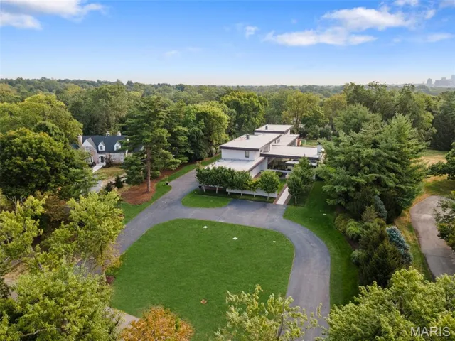View from above of property featuring a forest