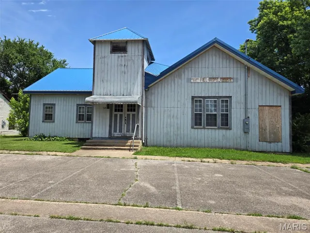 View of front facade featuring a metal roof