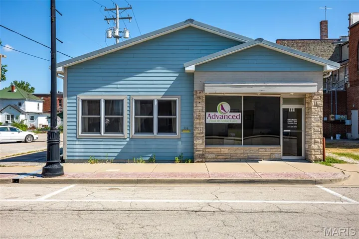 Townhome / multi-family property with stone siding