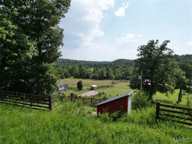 View of yard with a view of countryside and an outbuilding