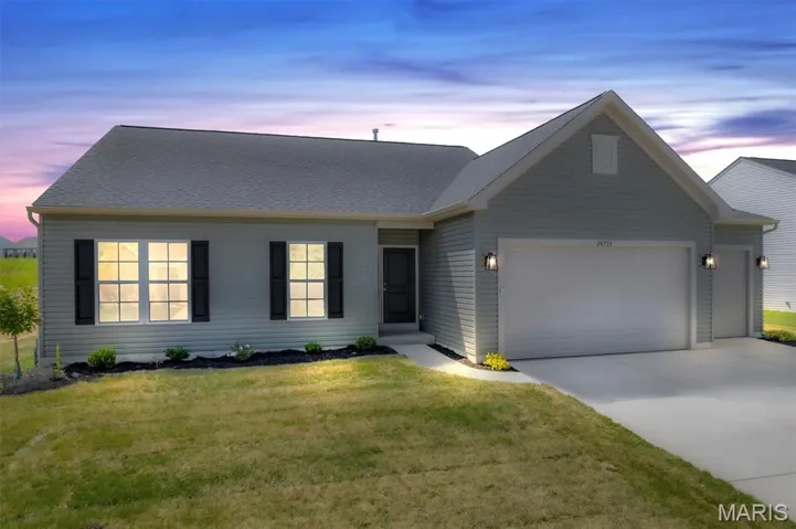 Single story home with an attached 5-car garage, driveway, a front lawn, and a shingled roof