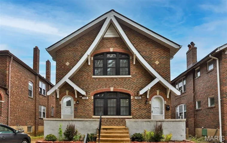 English style home with brick siding