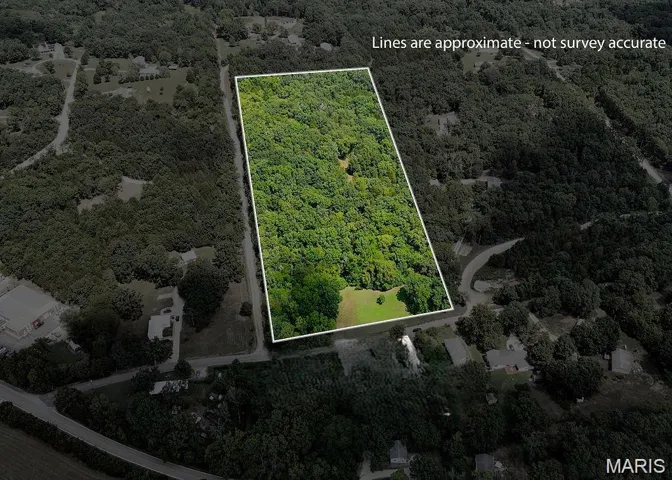 Aerial overview of property's location featuring a forest and property boundaries highlighted