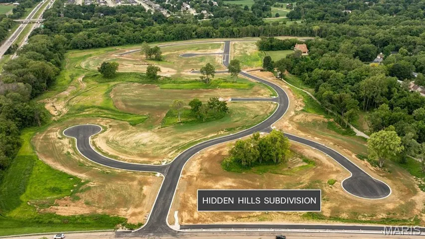 Aerial overview of property's location with a local golf course