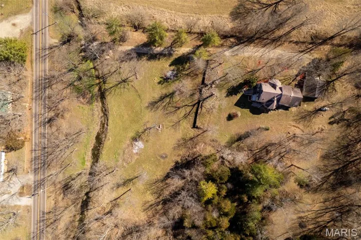 drone fly over of home and creek