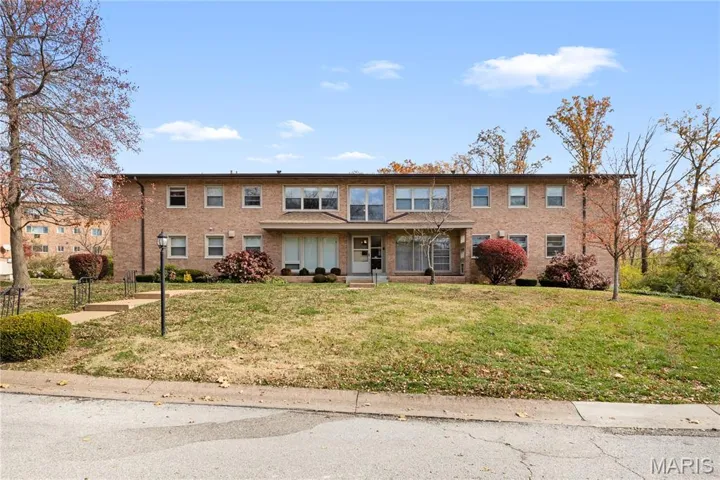 View of the front of the building featuring a well-sized front yard.