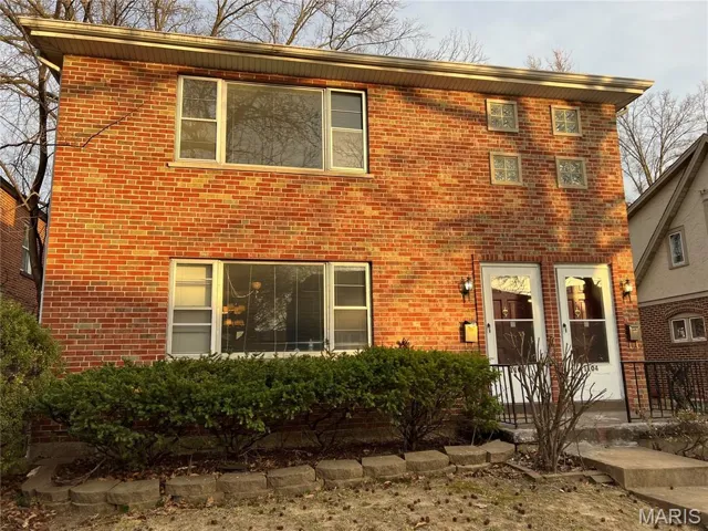 View of front of property with brick siding