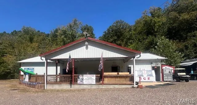 View of front of house with covered porch