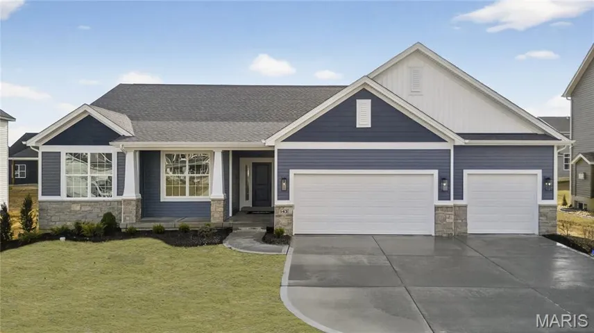 Craftsman inspired home with stone siding, a front lawn, driveway, and 3 Car Garage
