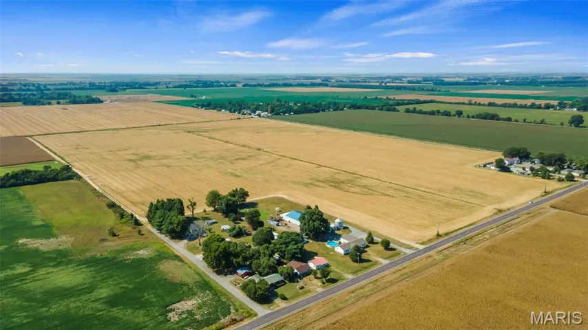 Aerial view of sparsely populated area with extensive farmland