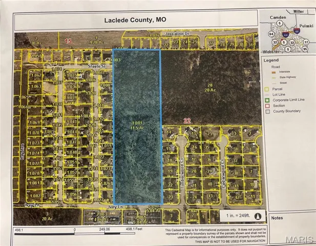 Aerial view of the land in between two subdivisions.