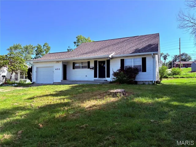 View of front of house with a garage, a front yard, a shingled roof, and a porch