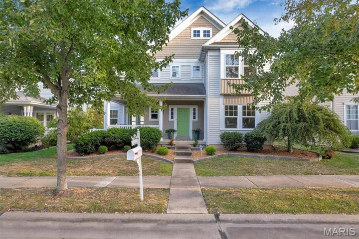 View of front of home featuring a porch and a front lawn