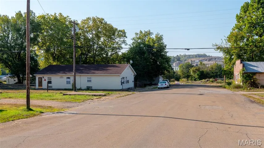 View of asphalt road and property