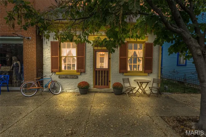 Entrance to property featuring brick siding