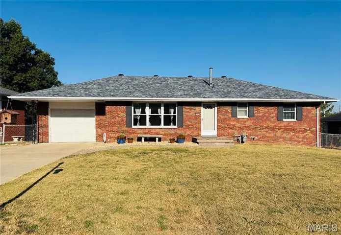 Ranch-style house featuring concrete driveway, a garage, brick siding, entry steps, and a shingled roof