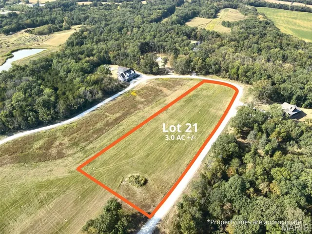 Aerial overview of property's location featuring property parcel outlined and a nearby body of water