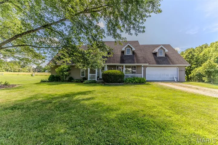 Front of home with 2-car garage.