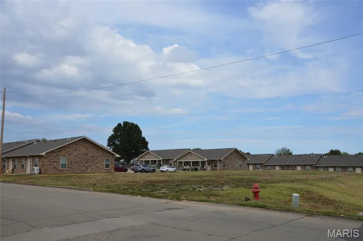 View of asphalt road with a residential view