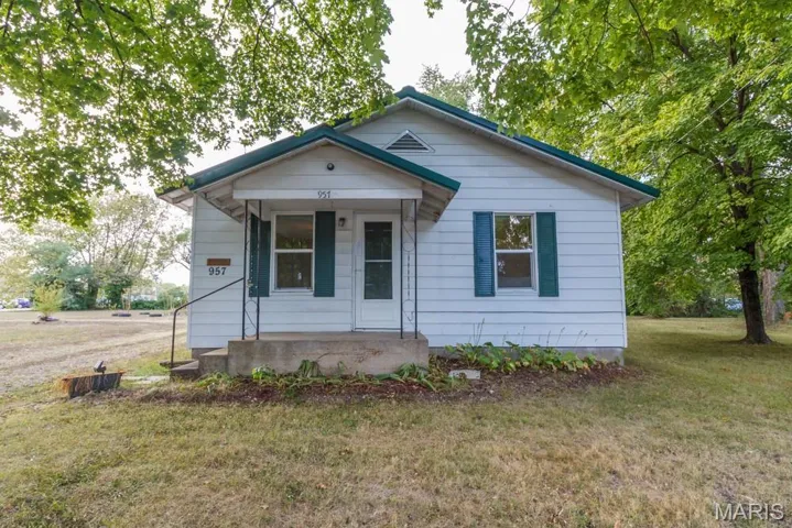 Bungalow-style home with a porch and a front yard