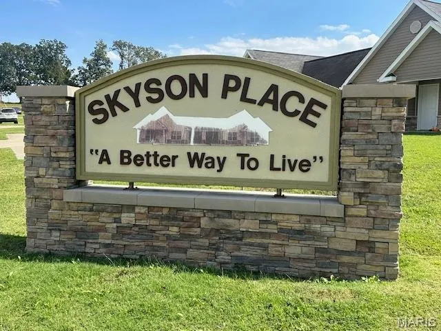 Community sign with a lawn