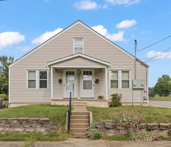 Bungalow-style house featuring a porch and a front yard