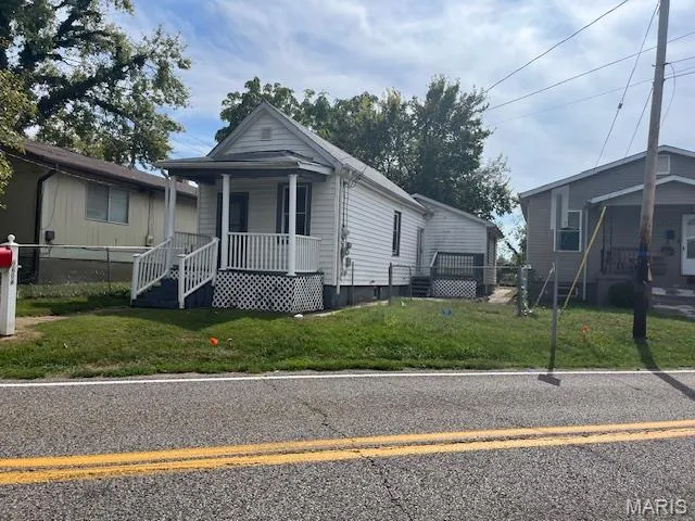 Bungalow-style home with a porch