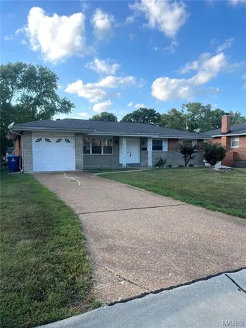 Single story home featuring brick siding, a front lawn, a garage, concrete driveway, and a porch