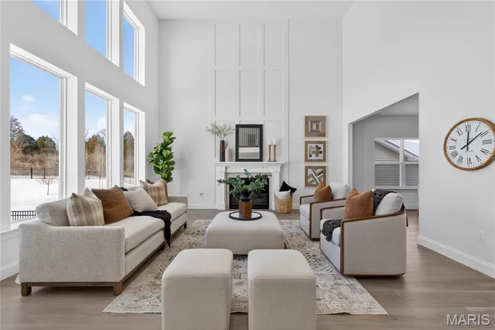 Upgraded 2-story Great Room with window wall and 42" direct vent Fireplace with custom accents to ceiling.