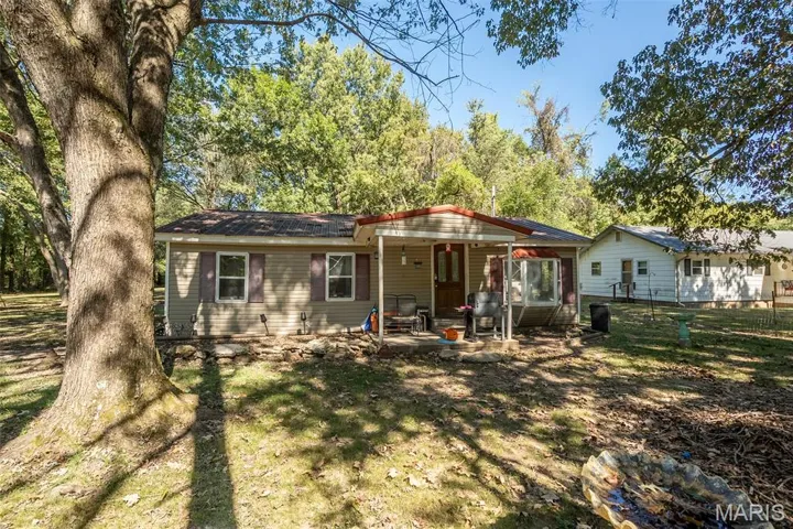 Back of property featuring a patio area