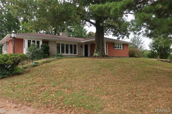 Welcome to this beautifully built brick and stone home 7860 Old Hwy 21